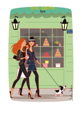 2 parisians wormen eating macarons in Paris